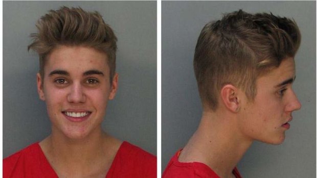 Mug shot ... Canadian teen pop singer Justin Bieber looked unusually happy after being arrested in Miami for drag racing and drink driving.