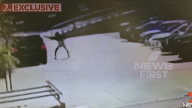 Footage shows the balaclava-clad gunman firing a barrage of bullets into the driver's side window of Hawi's car.