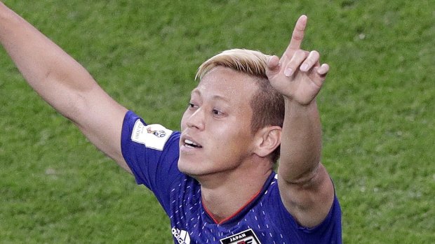 Keisuke Honda celebrates his equaliser for Japan.