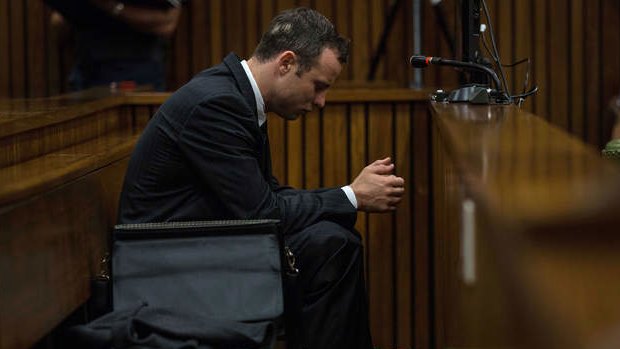 Harrowing evidence:  Oscar Pistorius appeared to be praying in court on Tuesday.