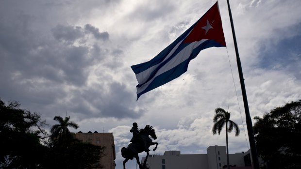 A Cuban flag is seen flying at half-mast, marking the start of two days of national mourning, in Havana on Saturday.