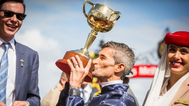 Jockey Corey Brown celebrates Rekindling winning the 2017 Melbourne Cup.