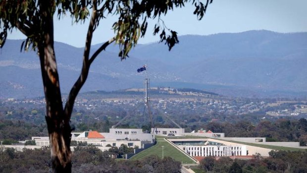 The flag at Parliament House, Canberra at half mast to honour the memorial for Nelson Mandela on Tuesday. Photo: Andrew Meares