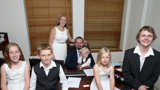 AMEP Senator Ricky Muir and partner Kerrie-Anne, together with their five children (L-R) Phoenix, William, Tristan, Tarja and Dylan in his office ahead of his first speech to the Senate, at Parliament House in Canberra on Thursday.