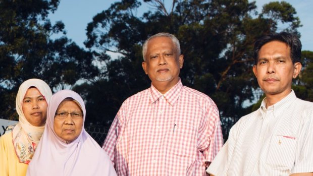 Piah Samat, mother, and Noriatin Umar, sister of convicted killer Sirul Azhar Umar, with Malaysian opposition politicians outside Villawood detention centre.
