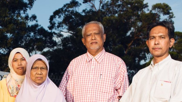 Piah Samat, mother, and Noriatin Umar, sister of convicted killer Sirul Azhar Umar, with Malaysian opposition politicians outside Villawood detention centre.