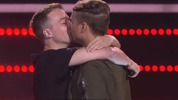 The couple shared a kiss after the on-stage proposal.