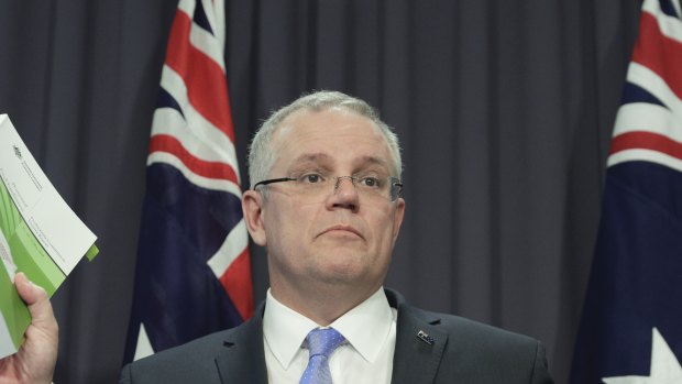 The Treasurer explains his new GST system at a press conference in Canberra.