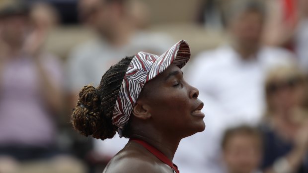 Venus Williams reacts after her first-round loss at the French Open.