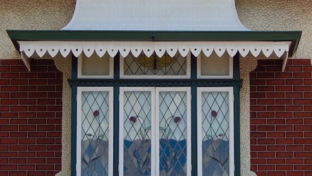 The Grundmann's home has stained glass poppies in the window.
