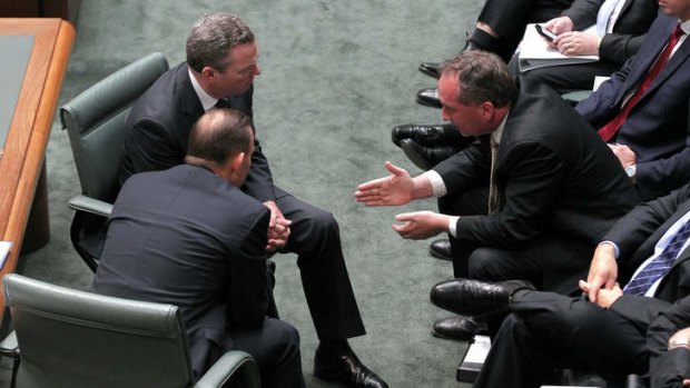 Prime Minister Tony Abbott, Leader of the House Christopher Pyne and Agriculture Minister Barnaby Joyce in discussion during Question Time on Monday.