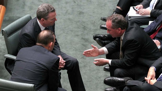 Prime Minister Tony Abbott, Leader of the House Christopher Pyne and Agriculture Minister Barnaby Joyce in discussion during Question Time on Monday.