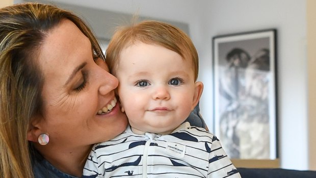 Libby Nuttall and her six-month-old son Elliott. She is one of many women who have private health cover but have opted to use the public system instead to give birth. 
