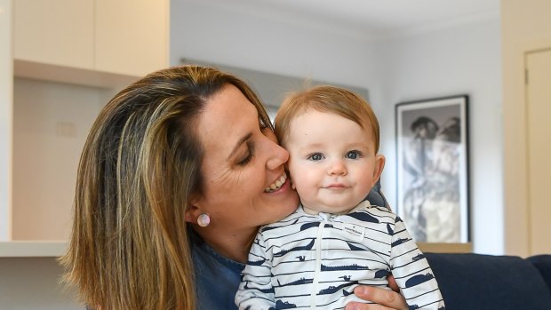 Libby Nuttall and her six-month-old son Elliott. She is one of many women who have private health cover but have opted to use the public system instead to give birth. 