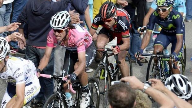 Cadel Evans keeps a close eye on race leader Rigoberto Uran during stage 14 of the Giro d'Italia.