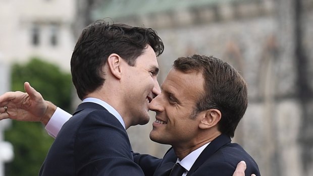 Justin Trudeau and Emmanuel Macron embrace in Ottawa ahead of the G7 summit.