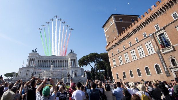 The Frecce Tricolori Italian Air Force acrobatic squad flies over the monument to the unknown soldier on the occasion of the 72nd anniversary of the Italian Republic in Rome. 