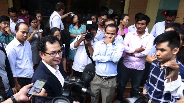 Kay Kimsong exits the Phnom Penh Post after being fired by the newspaper's new owner. 