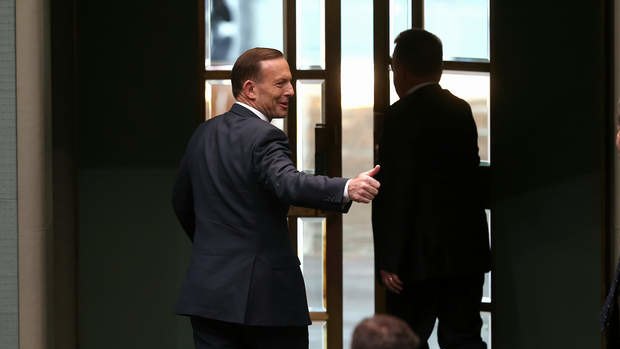 Prime Minister Tony Abbott departs after tabling the Report of the Royal Commission into the Home Insulation Program on Monday. Photo: Alex Ellinghausen