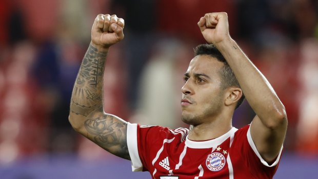 Match winner: Thiago celebrates at the final whistle after he scored Bayern's second in a 2-1 win.