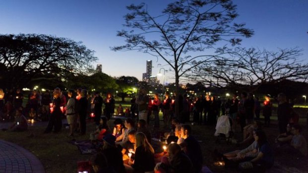 About 150 people gathered in the park for the candlelight vigil.