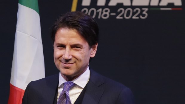 Giuseppe Conte smiles during a meeting in Rome. 
