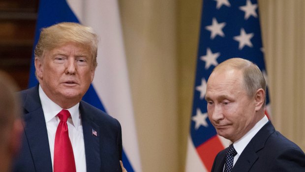 Donald Trump, left, and Vladimir Putin prepare to leave following a news conference in Helsinki.