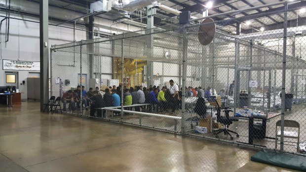 People in cages at a facility in McAllen, Texas,