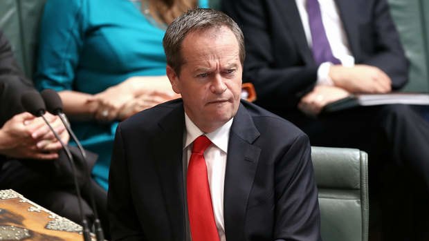 Opposition leader Bill Shorten listens to Prime Minister Tony Abbott on Wednesday.