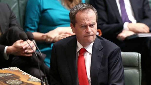 Opposition leader Bill Shorten listens to Prime Minister Tony Abbott on Wednesday.