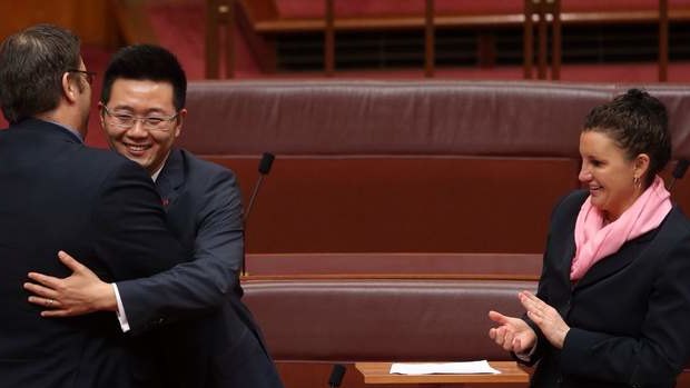 Senator Dio Wang was congratulated by Senator Glenn Lazarus and Senator Jacqui Lambie after his first speech. Photo: Andrew Meares