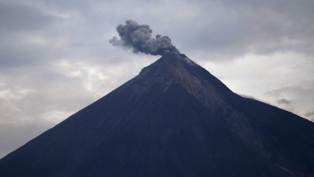 The Volcan de Fuego blows a cloud of ash on Thursday.