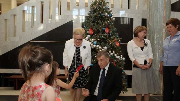 Speaker Bronwyn Bishop and President of the Senate John Hogg show Tina Salgado (left) and Sophia Salgado (right) the Parliament House giving tree at Parliament House. Photo: Alex Ellinghausen