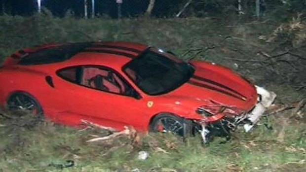 The Ferrari on the side of the Mitchell Freeway after its driver lost control.