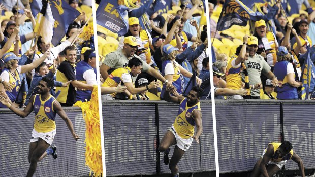 Oops: West Coast's Liam Ryan celebrates his goal, and then slips. 