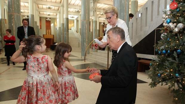 Speaker Bronwyn Bishop and President of the Senate John Hogg show Tina Salgado (left) and Sophia Salgado (right) the Parliament House giving tree. Photo: Alex Ellinghausen