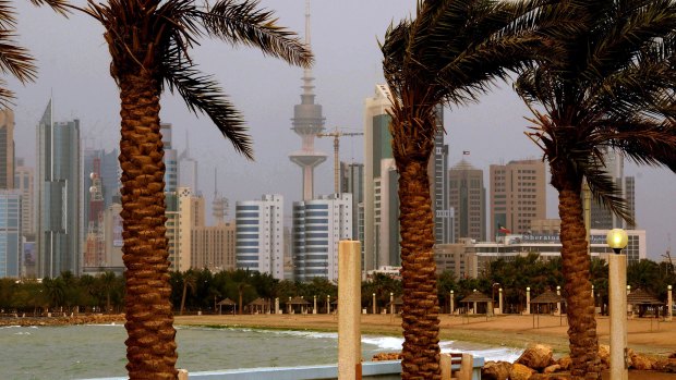 Kuwait city skyline is seen through the haze of a sand storm in Shuwaikh, Kuwait City. 