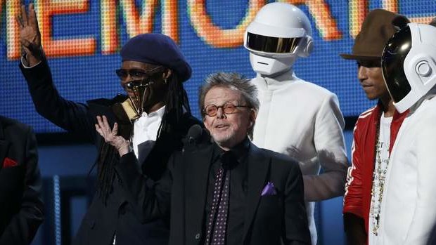 Producer Paul Williams accepts the award for Album of the year for Daft Punk's "Random Access Memories" as Nile Rodgers (L) and Pharrell Williams look on.