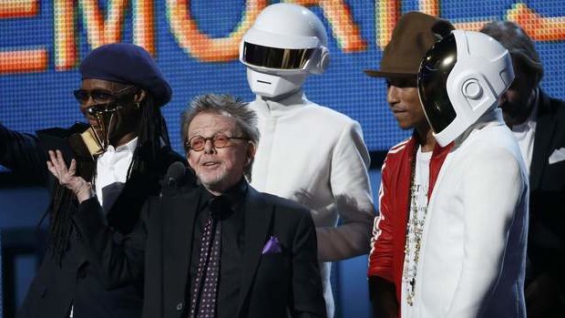 Producer Paul Williams accepts the award for Album of the year for Daft Punk's "Random Access Memories" as Nile Rodgers (L) and Pharrell Williams look on.