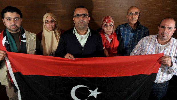 From left: Anwar Gebril, his wife Ragaa Il-Shawish, Gauhar Ezawi, his wife Amal Rhema, Abdulhadi Ezawi and Ahmed Sharef with the flag of post-Gaddafi Libya. All were based in Australia in May 2011.