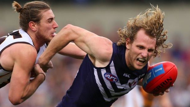 Dominant: David Mundy of the Dockers attempts to break away from  Ryan Schoenmakers of the Hawks.