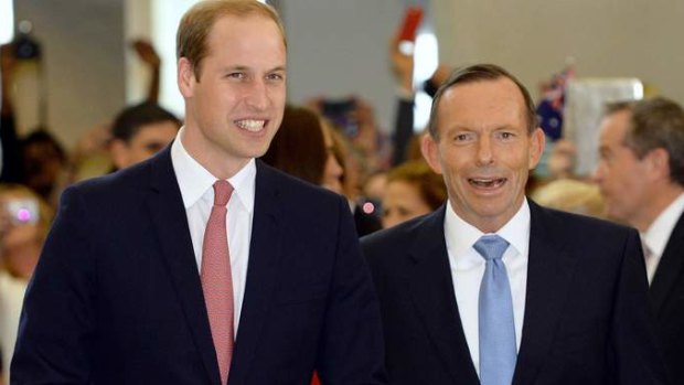 Australian Prime Minister Tony Abbott talks with Britain's Prince William (L) as they arrive at a reception at Parliament House in Canberra April 24, 2014.