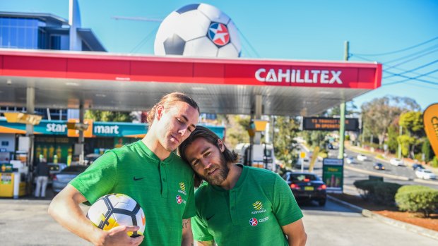 Fuelling controversy: Jackson Irvine and Josh Brilliant pose outside a Tim Cahill-themed Caltex.