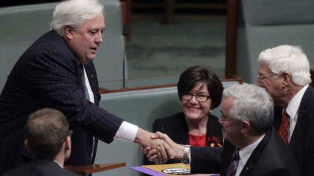 Clive Palmer Independent MP for Fairfax is congratulated by Bob Katter after made his maiden speech. Photo: Andrew Meares