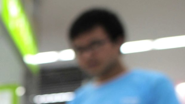 A salesperson stands at counters selling mobile phones produced by ZTE Corp. at an appliance store in Wuhan in central China\'s Hubei province. 