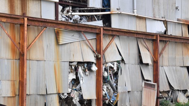 An abandoned warehouse in Industrial Avenue, Thomastown is stuffed full of rubbish. This photo was taken in August 2017.