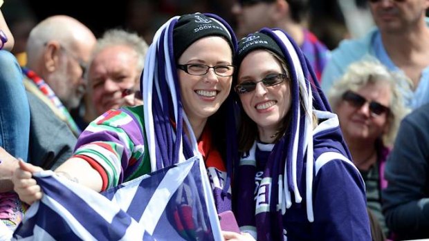 Fremantle supporters at the annual grand final parade through the streets of Melbourne.