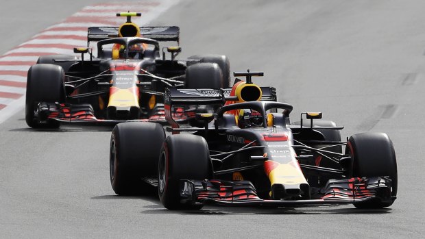 Australia driver Daniel Ricciardo, bottom, steers his Red Bull followed by his teammate Max Verstappen.
