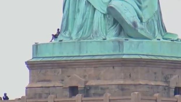 The female protester scaled the iconic landmark on Independence Day in the US.