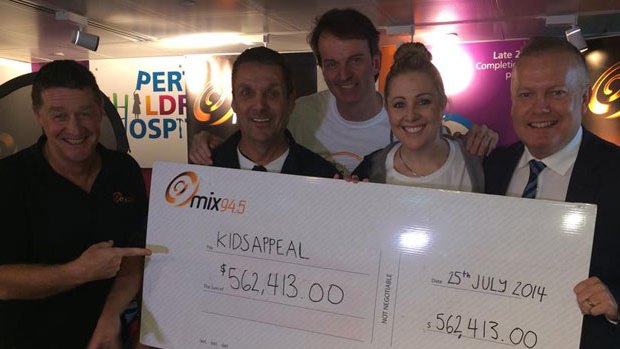 The breakfast team from mix94.5 handed over a cheque to staff at Princess Margaret Hospital.
